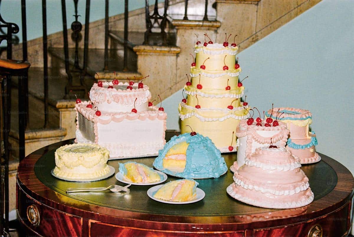 A colorful display of various decorative cakes